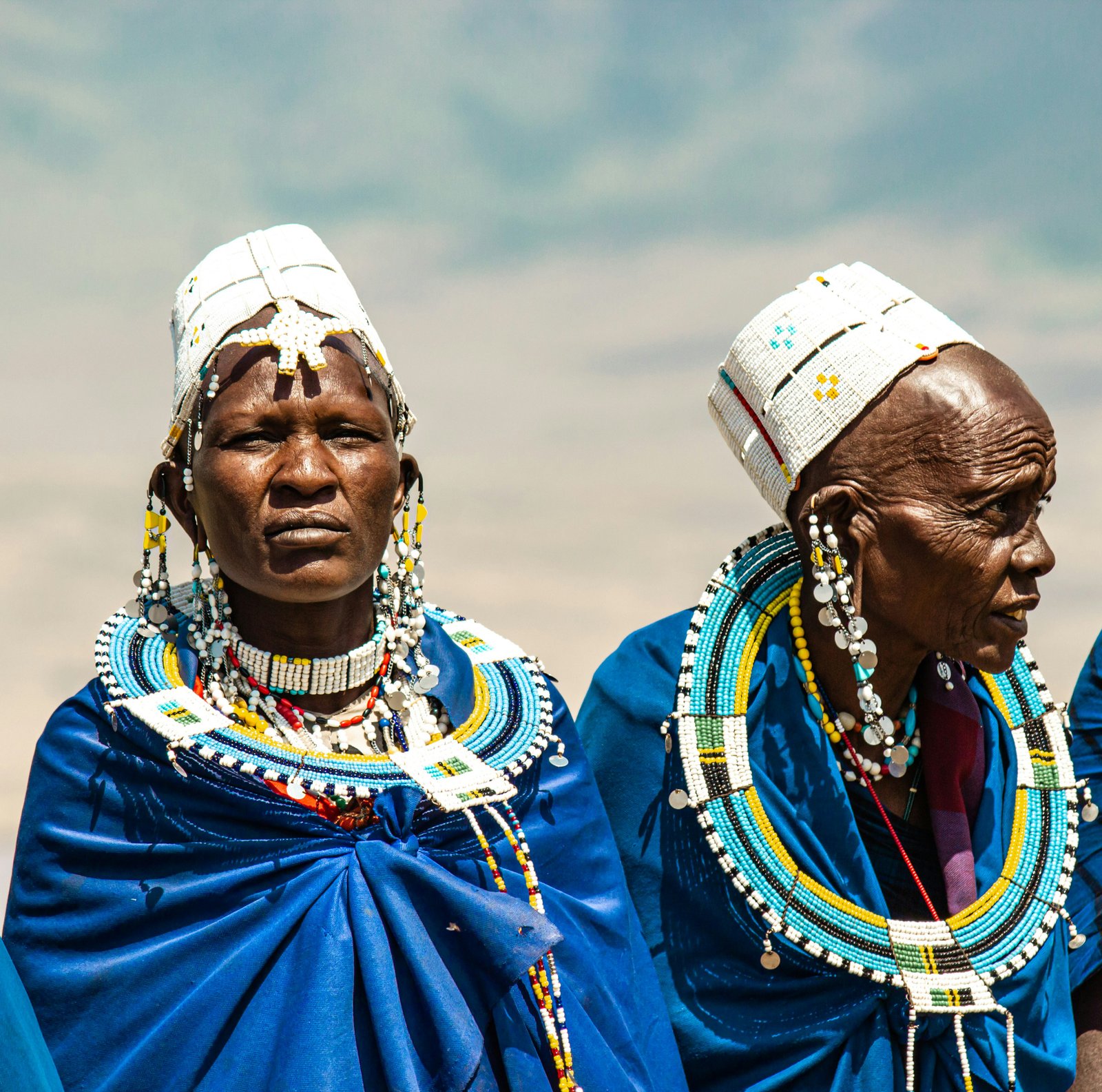 Two Maasai women in traditional blue robes and beaded jewellery, Ngorongoro area, Tanzania