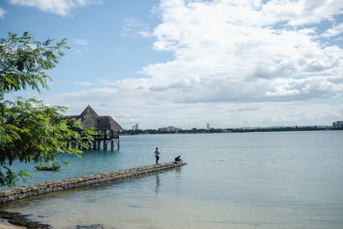 Stone pier at The Slipway with thatched restaurant over the water, Dar es Salaam harbour, Tanzania