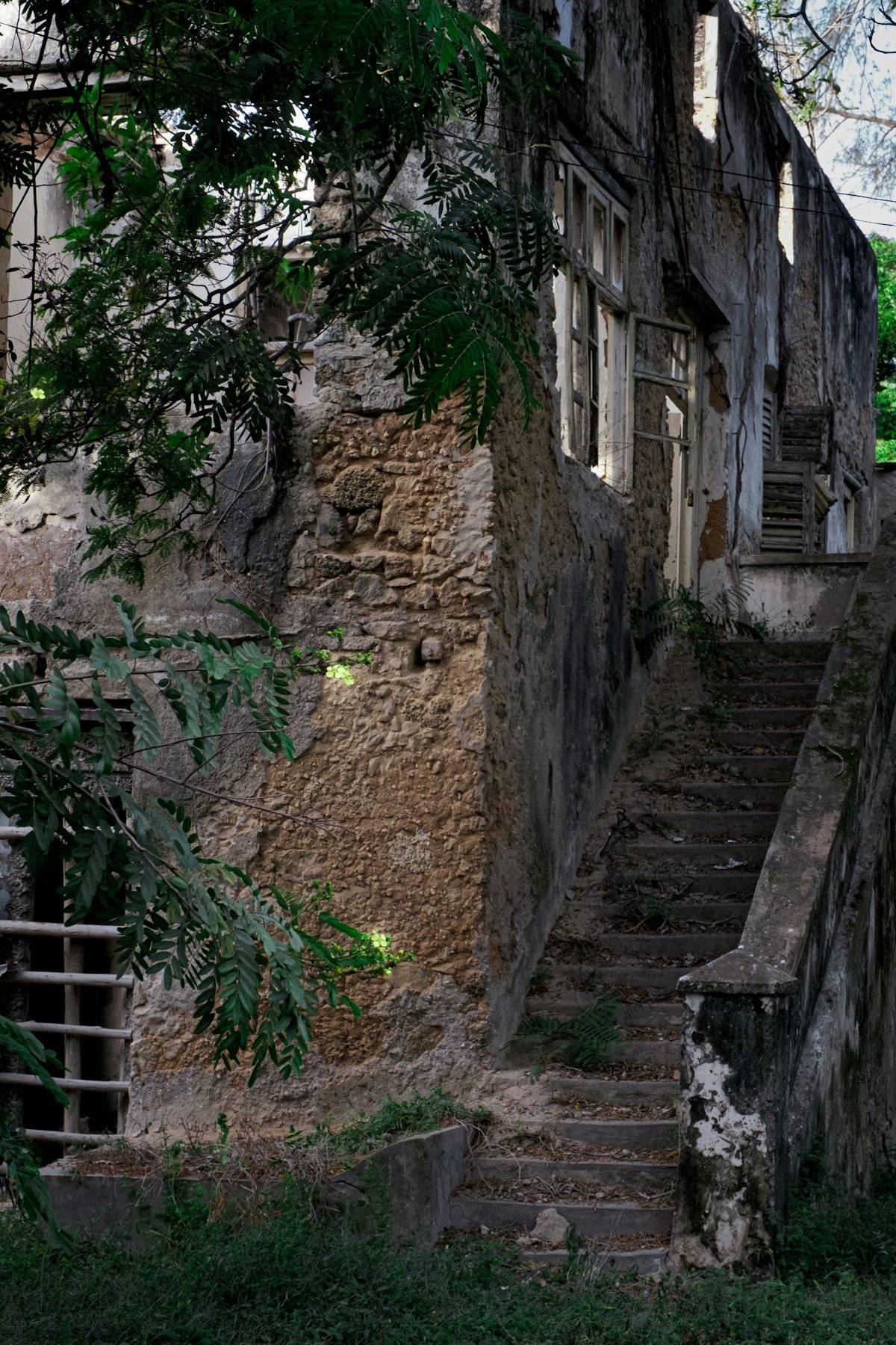 Crumbling colonial-era stone building with steps, Bagamoyo, Tanzania
