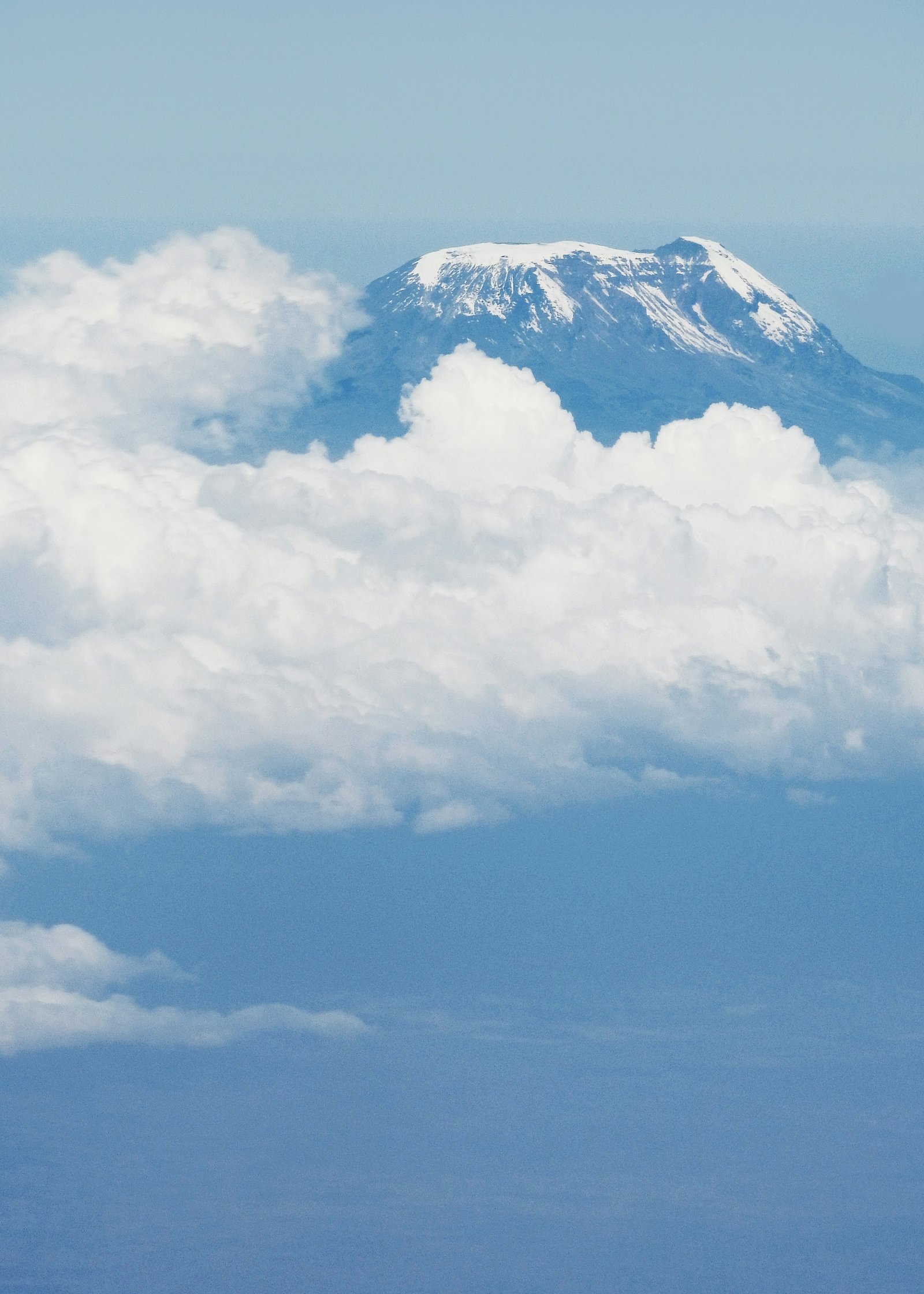 Mount Kilimanjaro summit rising above clouds, Tanzania