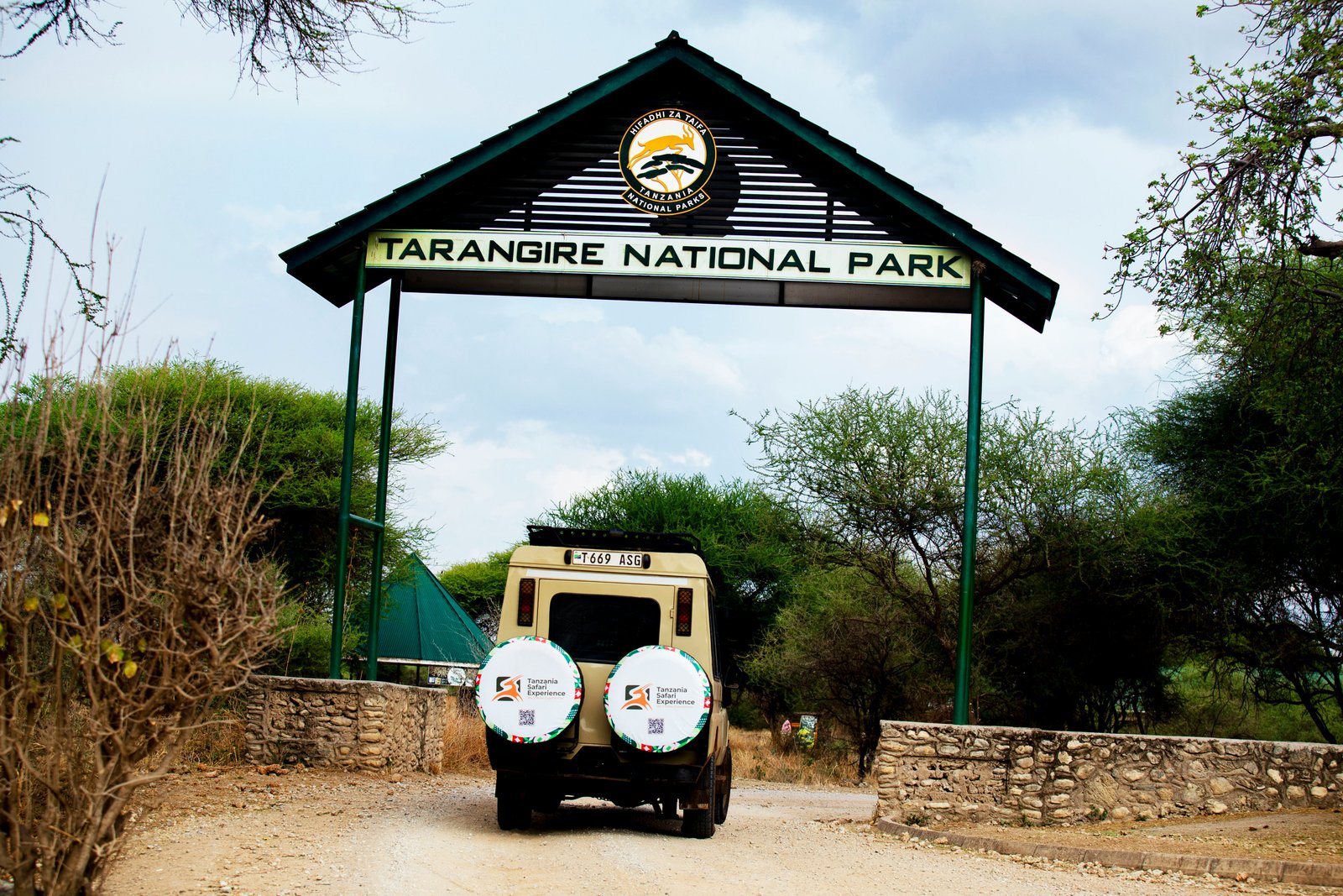 Safari vehicle entering Tarangire National Park entrance gate, Tanzania