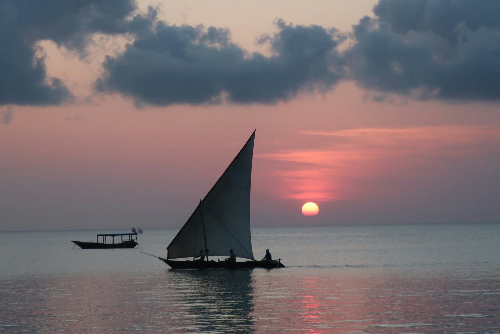 Turquoise water and a traditional wooden dhow off the coast of Zanzibar